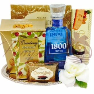 Something Blue Tequila Gift Basket with 1800 Silver Tequila and sweet snacks on a silver tray
